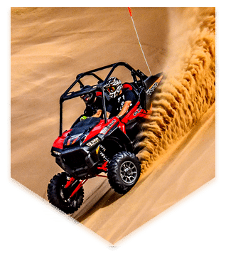 driving scene of polaris rzr 2 seater in desert