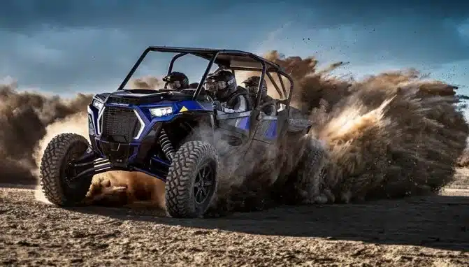 rushing dune buggy in dubai desert